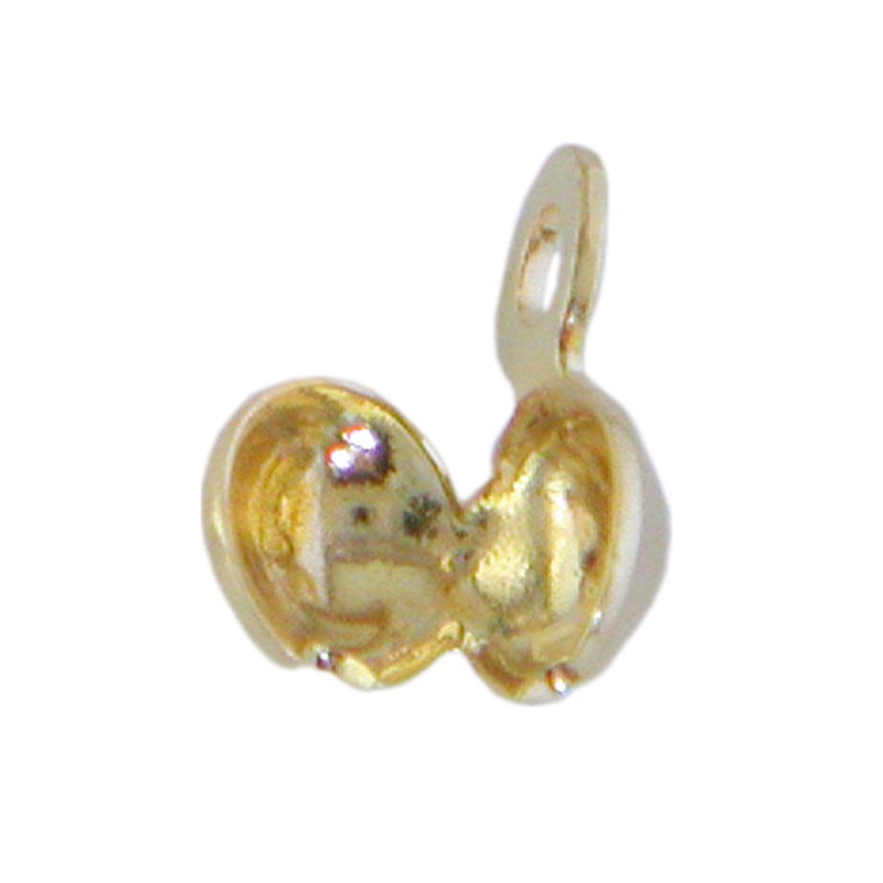 Squeeze capsules with closed eyelet, gold plated